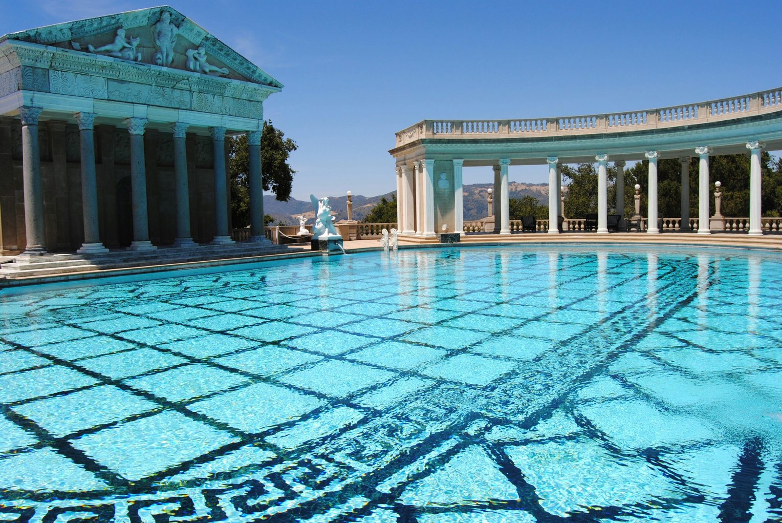 people in swimming pool during daytime